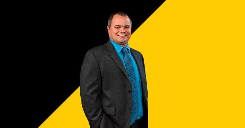 Stephane Brochu on a black and yellow background
